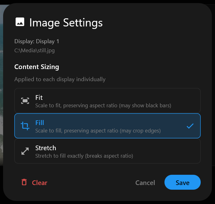 The Image Settings dialog for a still image, with the Content Sizing options Fit, Fill and Stretch, Fill checked, and the Clear, Cancel and Save buttons.