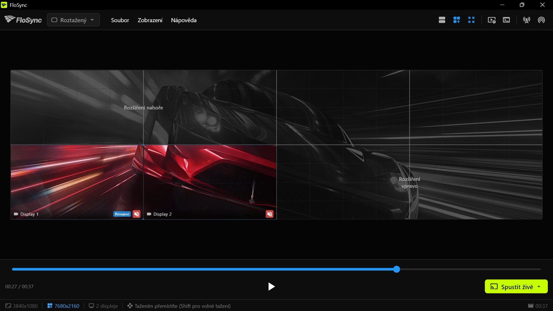 FloSync na PC 3, zobrazující obsah na svých dvou obrazovkách v levé dolní části stěny a zbytek plátna jako virtuální prostor.