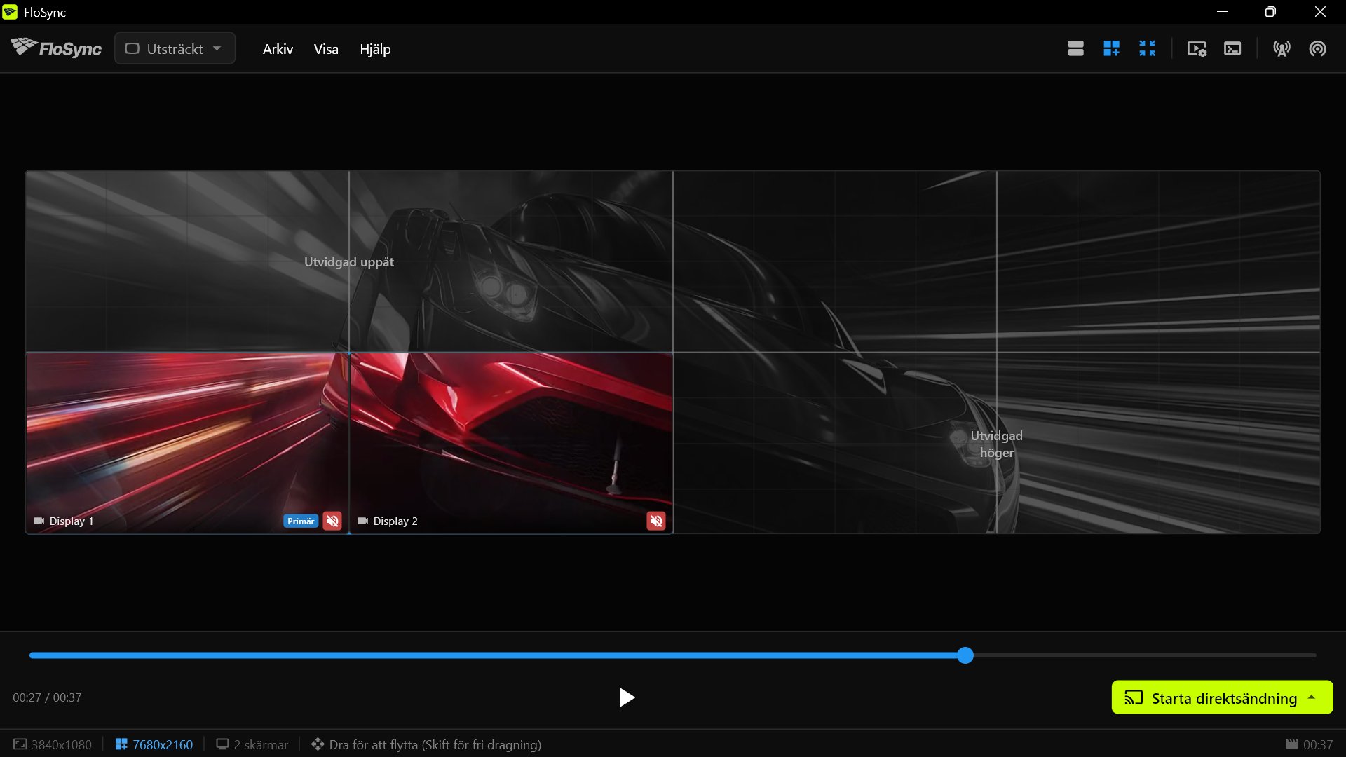 FloSync på PC 3, med innehåll på de två lokala skärmarna längst ner till vänster på väggen och resten av duken som ett nedtonat virtuellt område.